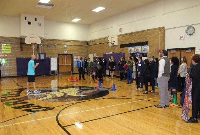 Mr. Denk explains a game used in P.E. class.